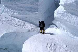 Ian Rogers in the Khumbu Icefall. The crevasse is very deep!