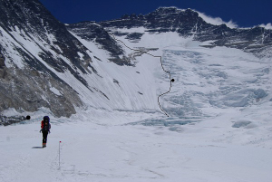 The Western Cwm and the Lhotse Face. C2/ABC is just left of the Sherpa at 6400m. The route up the face is indicated by the line, and C3 by the black dot. South Col is out of sight center left.