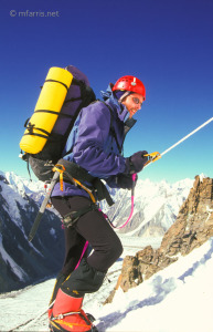 Paul Walters on K2. The yellow device in his hand is an ascender, which slides up the rope but grips when he pulls down. It's attached to his climbing harness. While he pulls some on the rope, his legs do most of the work.