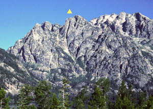 Symmetry Spire is beneath the yellow triangle. The scree gully is filled with snow early in the year